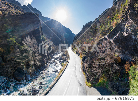 The mountain river along the Road, Aerial panoramic drone view of a scenic highway by the beautiful Landscape covered in clouds and fog, bridge and viaduct, The mountain river along the road, The mountain river along the Road, Aerial panoramic drone view of a scenic highway by the beautiful Landscape covered in clouds and fog, bridge and viaduct, The mountain river along the road, 67616975