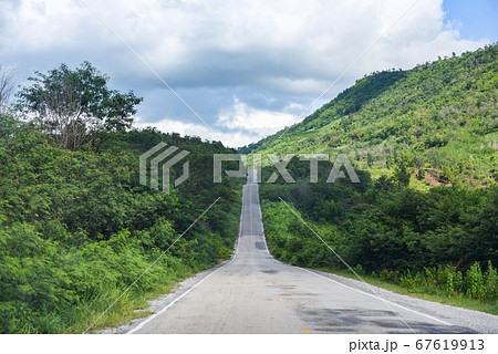 Road to mountain / A long straight road leading Road to mountain / A long straight road leading 67619913