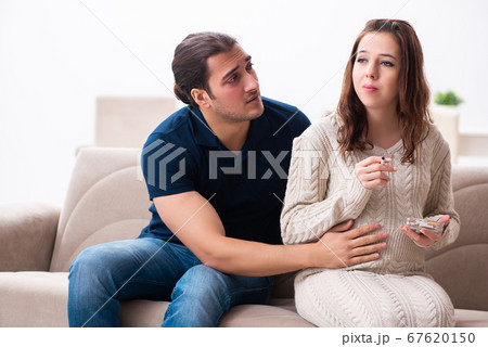 Man and pregnant woman in antismoking concept 67620150