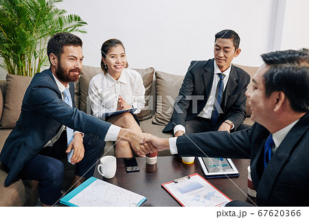 Business partners shaking hands 67620366