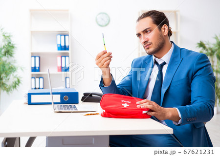 Young male employee in first aid concept Young male employee in first aid concept 67621231