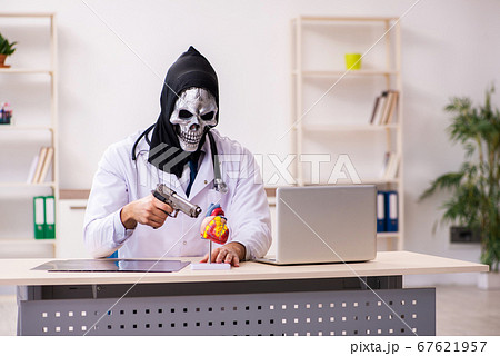 Male devil doctor working in the clinic Male devil doctor working in the clinic 67621957
