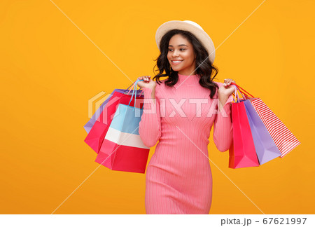 Happy ethnic shopper with paper bags. 67621997