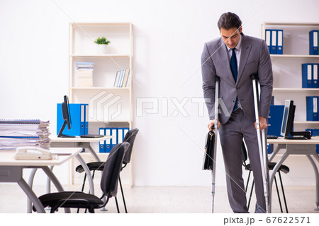 Leg injured employee in the office 67622571