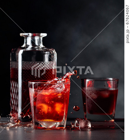 Pieces of ice fall into a frosted glass with Pieces of ice fall into a frosted glass with 67624067