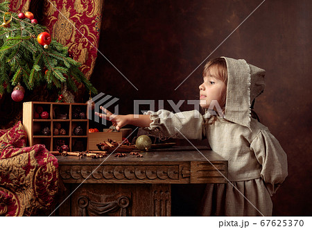 Little girl in an vintage linen dress near the Little girl in an vintage linen dress near the 67625370