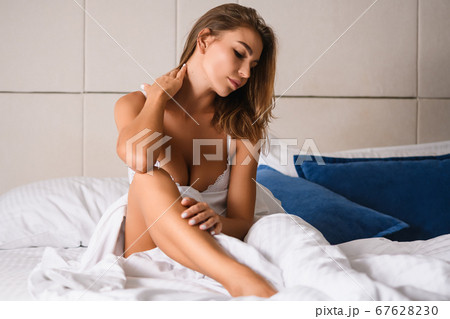 Beautiful wake up of woman in bed  67628230