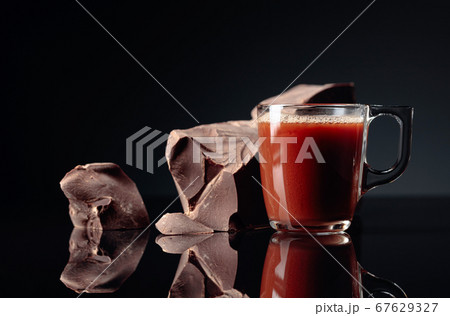 Pieces of dark bitter chocolate and cup with hot 67629327