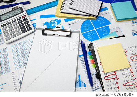 business office desk closeup - financial reports, 67630087