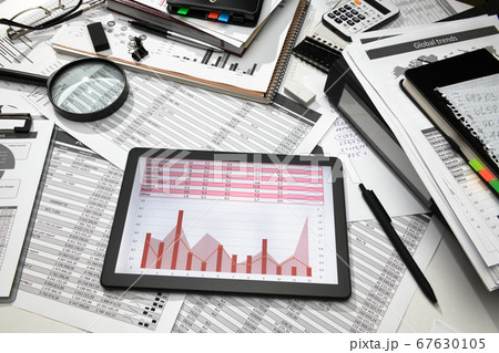 business office desk closeup - tablet computer 67630105