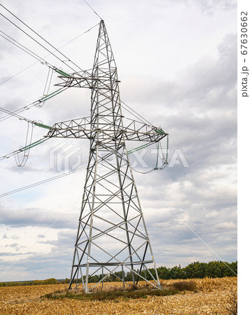 Towers of high-voltage energy transfer against a cloudy sky. Towers of high-voltage energy transfer against a cloudy sky. 67630662