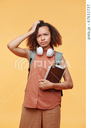 Puzzled student girl Puzzled student girl 67631737