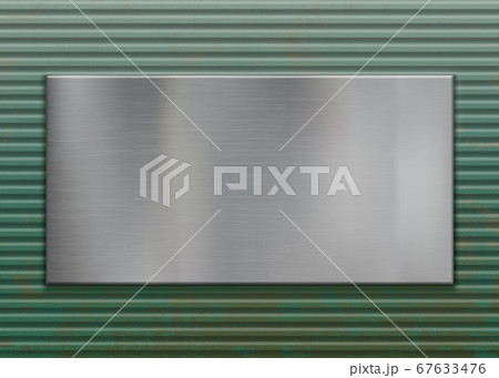 Polished metal plate on a corrugated steel background 67633476