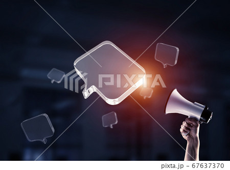 Announcement and communication concept with message buuble on dark background. Mixed media Announcement and communication concept with message buuble on dark background. Mixed media 67637370