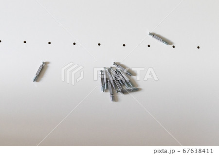 Various types of screws, connectors and tools. 67638411