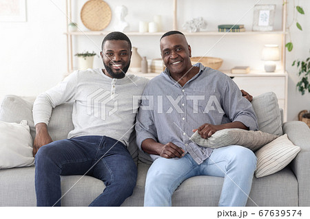 Portrait With Dad. Happy Black Man Posing With Mature Father At Home 67639574