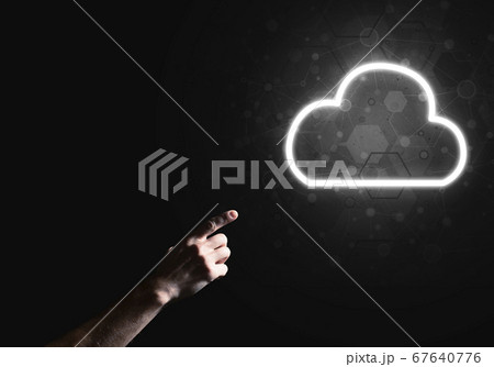 Digital cloud icon as symbol of wireless connection on dark background Digital cloud icon as symbol of wireless connection on dark background 67640776