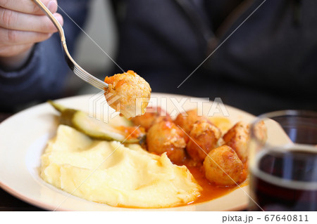 Lunch of meatballs and mashed potatoes on a plate closeup. 67640811