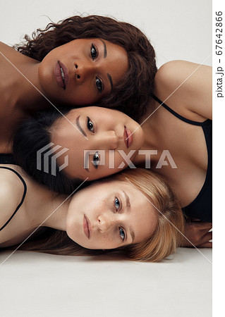 Group of women with different body and ethnicity posing together to show the woman power and strength. Curvy and skinny kind of female body concept Group of women with different body and ethnicity posing together to show the woman power and strength. Curvy and skinny kind of female body concept 67642866