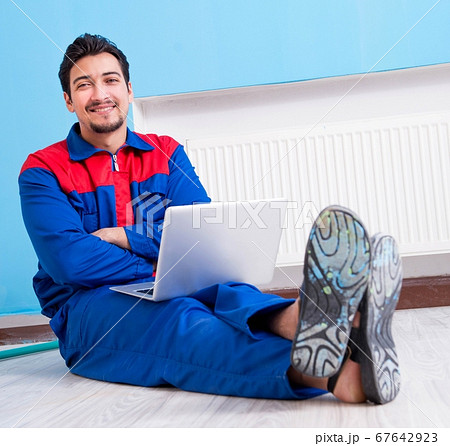 Young painter doing renovation at home Young painter doing renovation at home 67642923