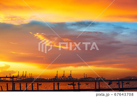 cranes on seaport and sunset red blue sky and cranes on seaport and sunset red blue sky and 67643708