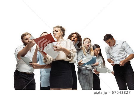 Nervous tensioned investors analyzing crisis stock market with charts on screen of their gadgets 67643827