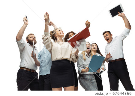 Hopeful and happy investors analyzing crisis stock market with charts on screen of their gadgets 67644366