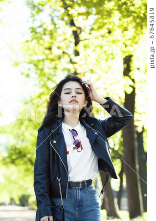 pretty young asian woman smiling cheerful in green park on summer sunny day, lifestyle people concept pretty young asian woman smiling cheerful in green park on summer sunny day, lifestyle people concept 67645819