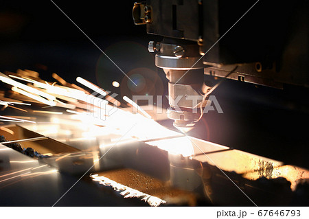 Sparks flying out of machine head during production process 67646793
