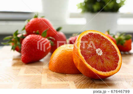 Fresh juicy fruit and berries on table 67646799