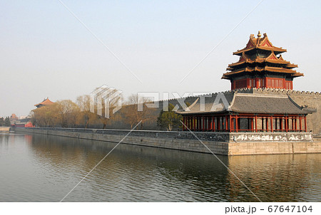 Forbidden City, Beijing, China. A corner tower seen from outside the Forbidden City. The Forbidden City has traditional Chinese architecture. The Forbidden City is also the Palace Museum, Beijing. Forbidden City, Beijing, China. A corner tower seen from outside the Forbidden City. The Forbidden City has traditional Chinese architecture. The Forbidden City is also the Palace Museum, Beijing. 67647104
