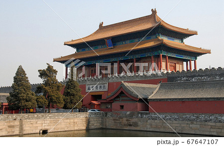 Forbidden City, Beijing, China. The sign says: Gate of Divine Might, the exit from the site. The Forbidden City has traditional Chinese architecture. The Forbidden City is the Palace Museum, Beijing. 67647107