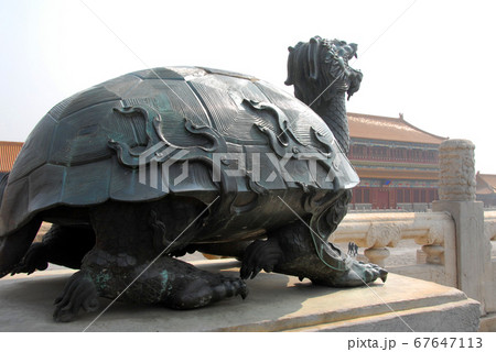 Forbidden City, Beijing, China. Bronze statue of a turtle inside the Forbidden City. The Forbidden City has traditional Chinese architecture. The Forbidden City is also the Palace Museum, Beijing. 67647113