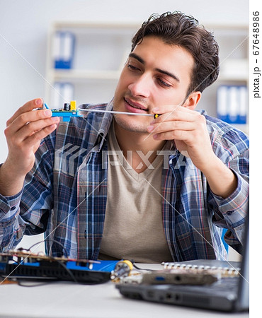 Computer hardware repair and fixing concept by experienced techn 67648986