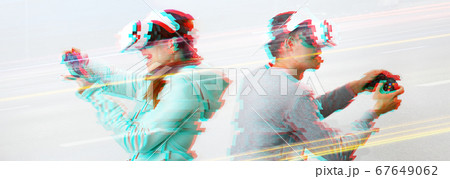 Man and woman with virtual reality headset are playing game. Image with glitch effect. 67649062