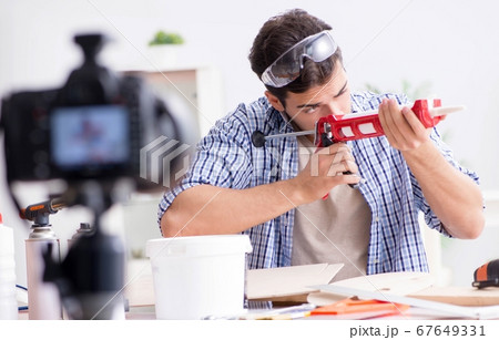DIY blogger recording video of woorworking hobby 67649331