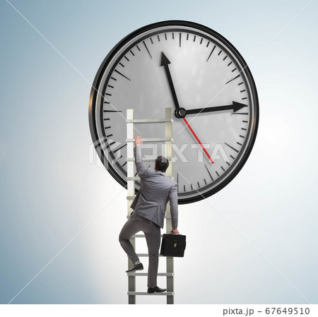 Businessman in time management concept Businessman in time management concept 67649510