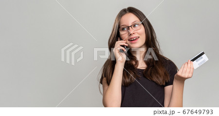 banking service cashless payment happy woman phone 67649793