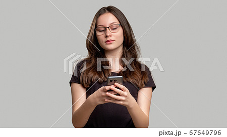 online chat mobile app curious woman reading phone 67649796