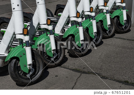Rental Electric Scooters, e-scooter, Parked In Group On The Pavement 67651201