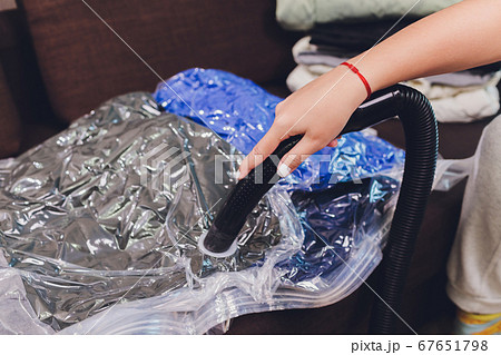 Space saver saving seal bag sucking air out , vacuum clothing storage compressed package. 67651798