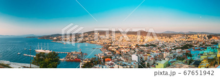 Kusadasi, Aydin, Aydın Province, Turkey. Waterfront And Kusadasi Cityscape In Sunny Summer Evening. Scenic View Of Kusadasi Skyline At Aegean Coast, Turkey. Panorama, Panoramic View 67651942