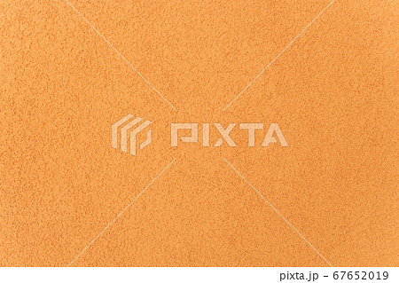 The yellow plastered wall with fine texture. 67652019