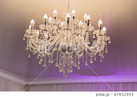 small lamp as stars at big chandelier with many crystals. small lamp as stars at big chandelier with many crystals. 67652033