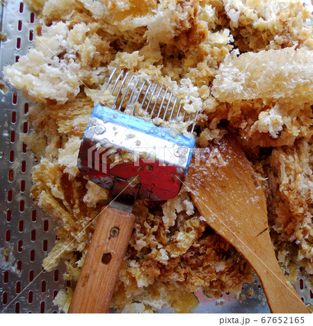 wax honeycomb from a bee hive filled with golden 67652165