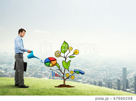 Young businessman outdoors watering drawn growth concept with can 67660208
