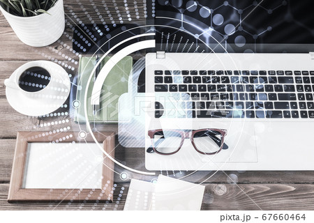 Business workplace with laptop coffee cup and security concept o 67660464