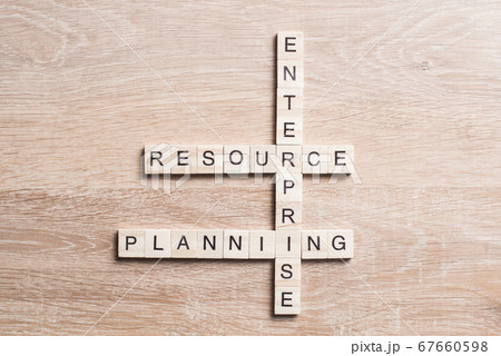Conceptual business keywords on table with elements of game making crossword 67660598