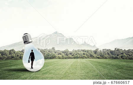 Businesswoman inside light bulb 67660657