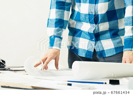 Architect workplace with paper blueprints. 67661434